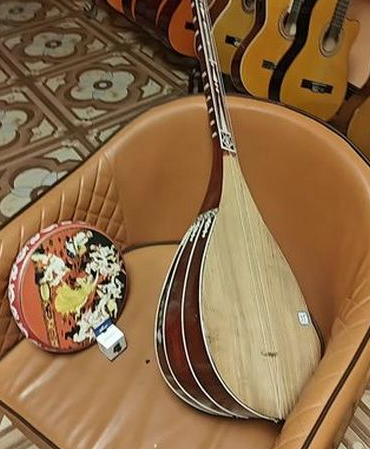 弹布尔与都塔尔：新疆弹拨乐器的双生花