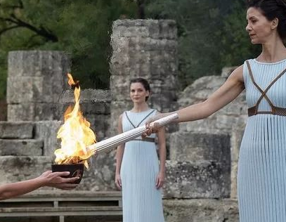 Why does the flame burn on Mount Olympus? What does it represent?