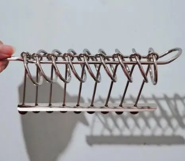 世界上蒙眼分解九连环速度最快的人是谁？有多快？